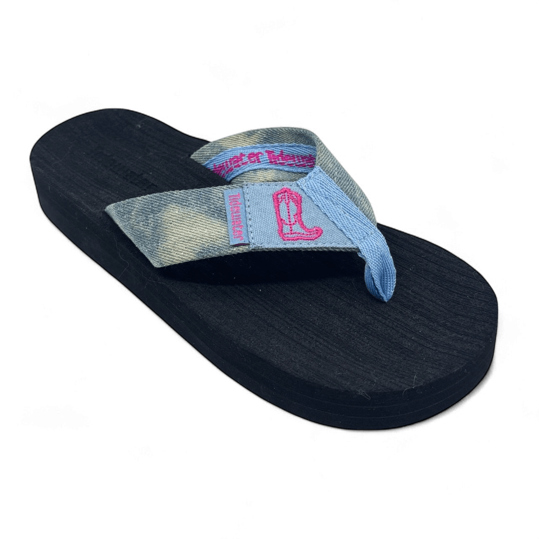 Denim flip flop sandal with pink embroidered cowgirl boot design on strap and black comfort footbed

